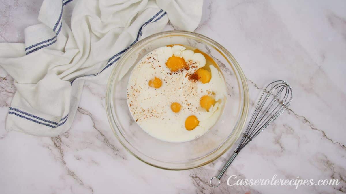 glass bowl of eggs and milk