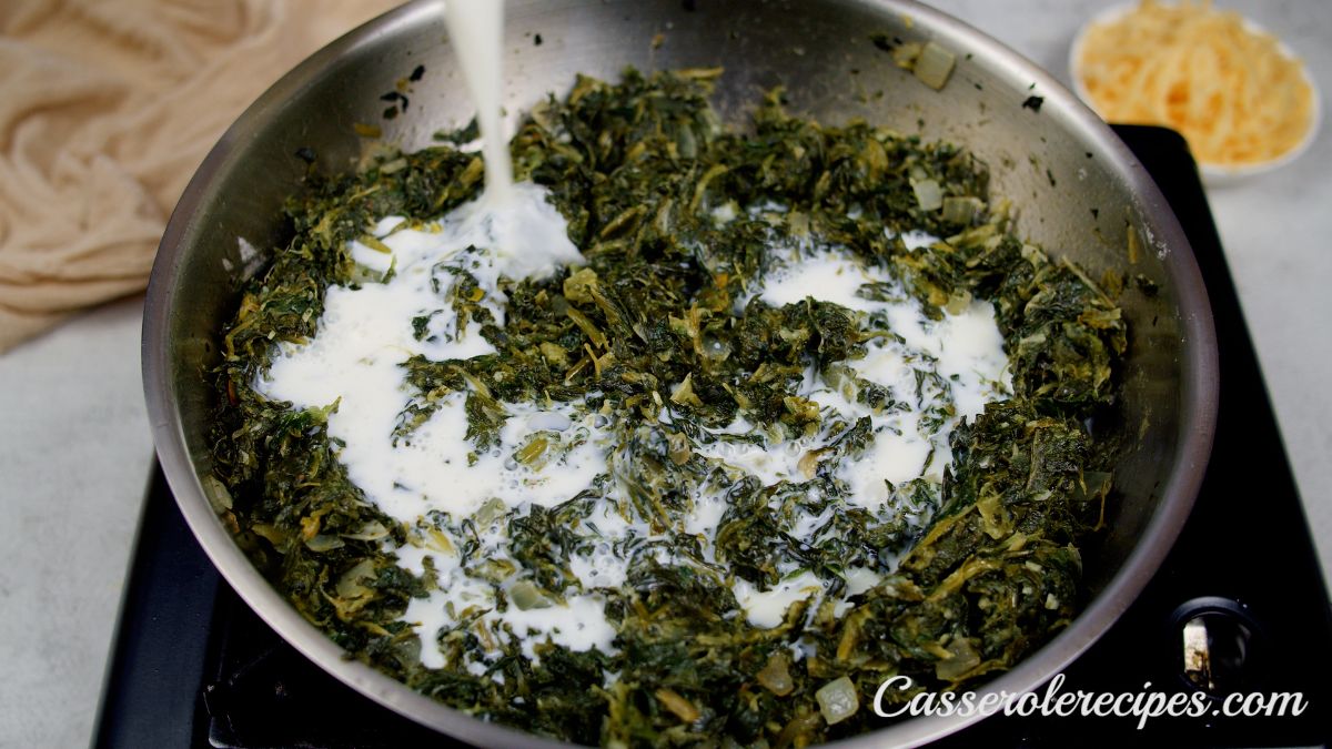 spinach in skillet on hot plate