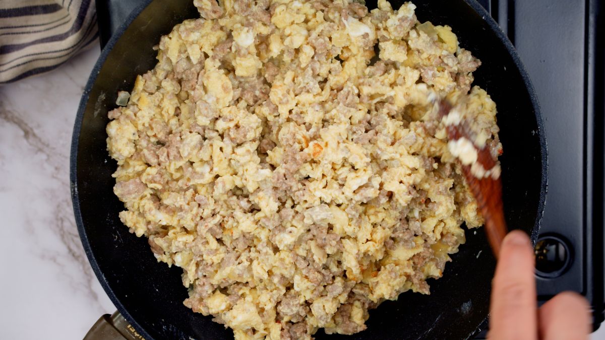 ground beef and eggs cooked in skillet
