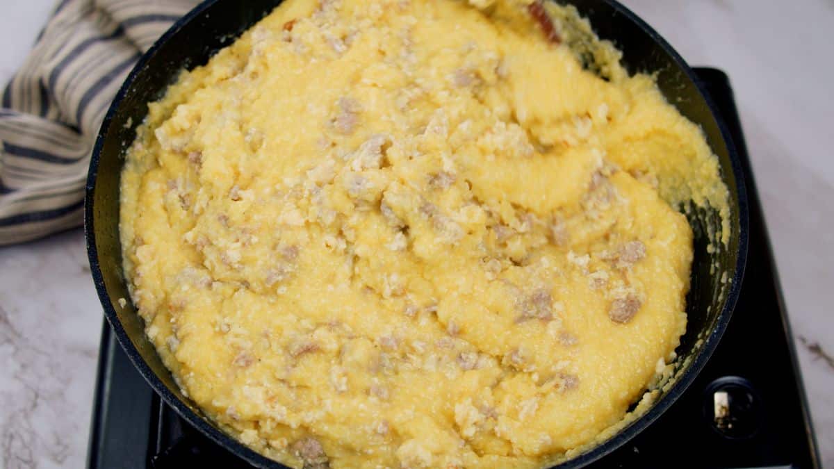 grits and ground meat stirred together in skillet