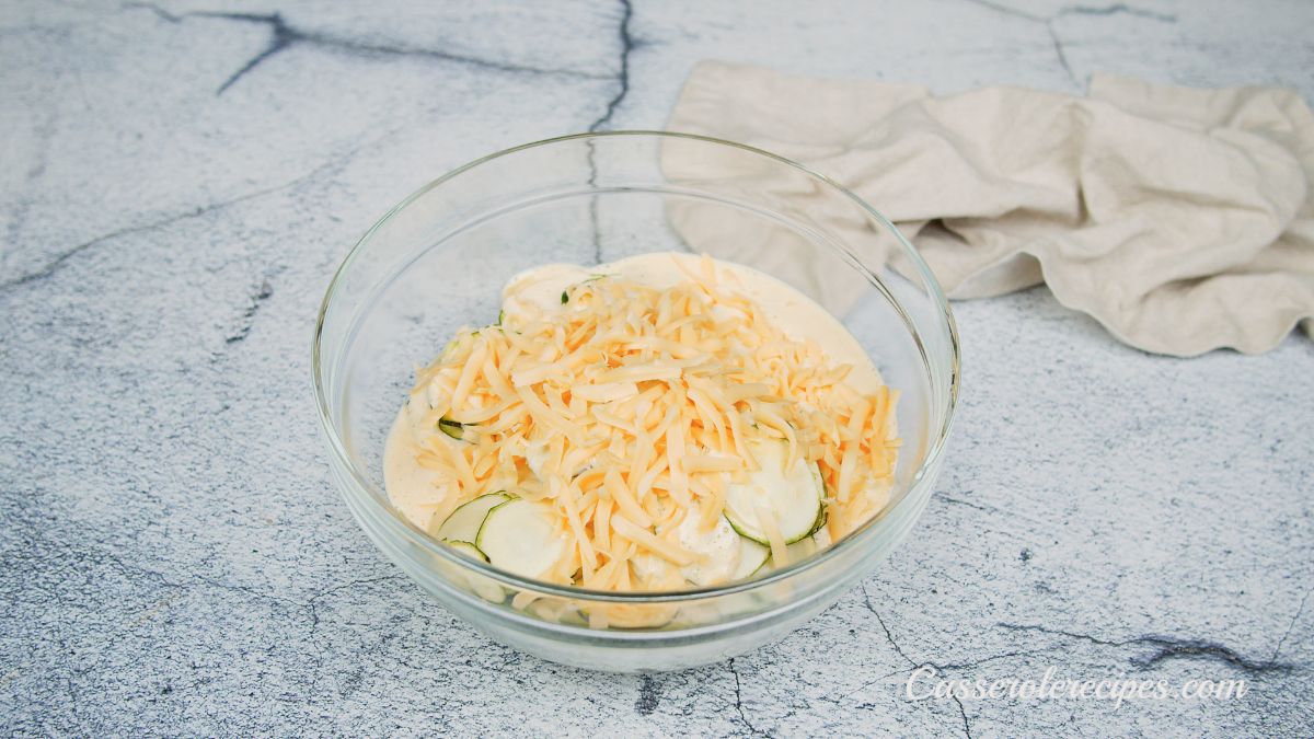 cheese on top of squash and cream in bowl
