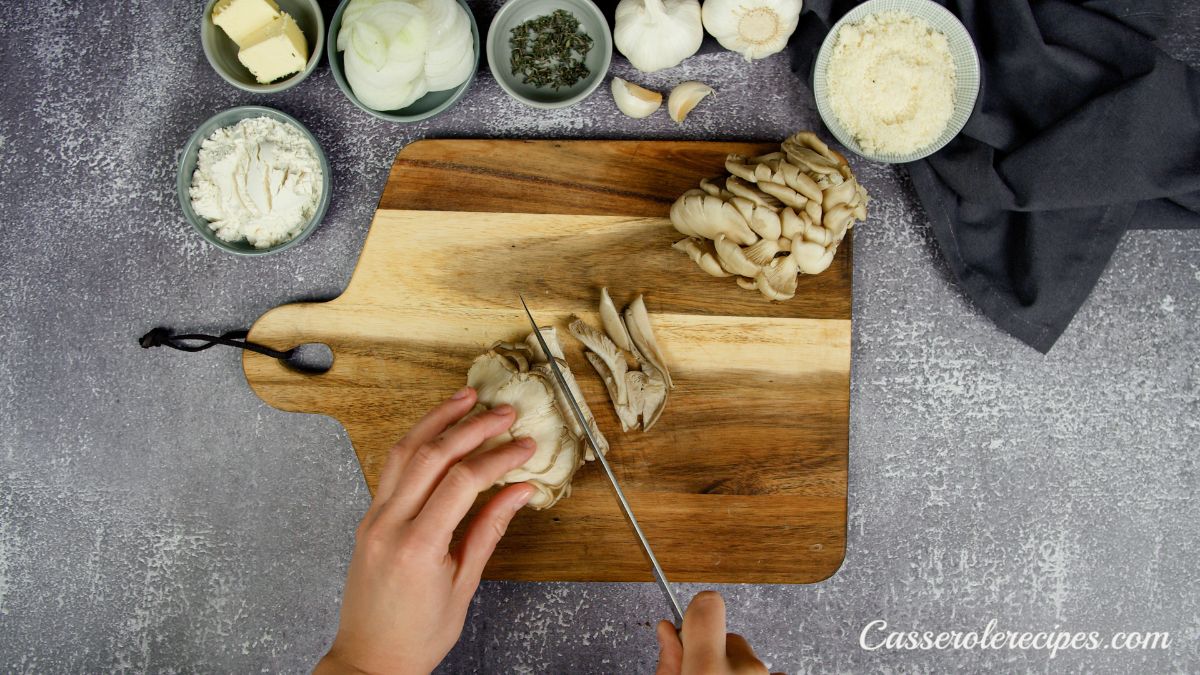 mushrooms being sliced on cutting board