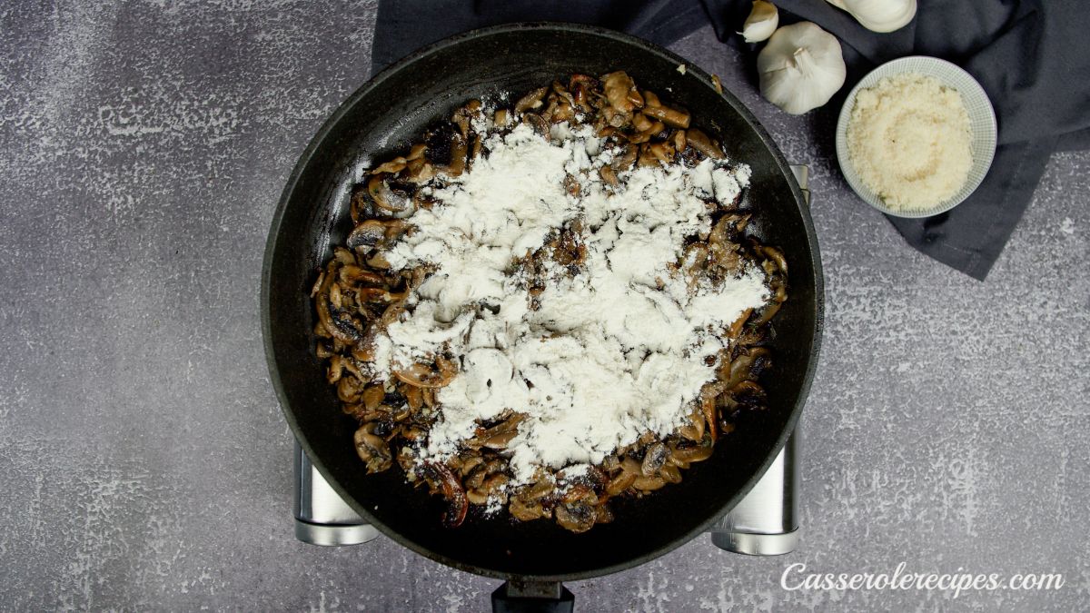 flour on top of cooked mushrooms