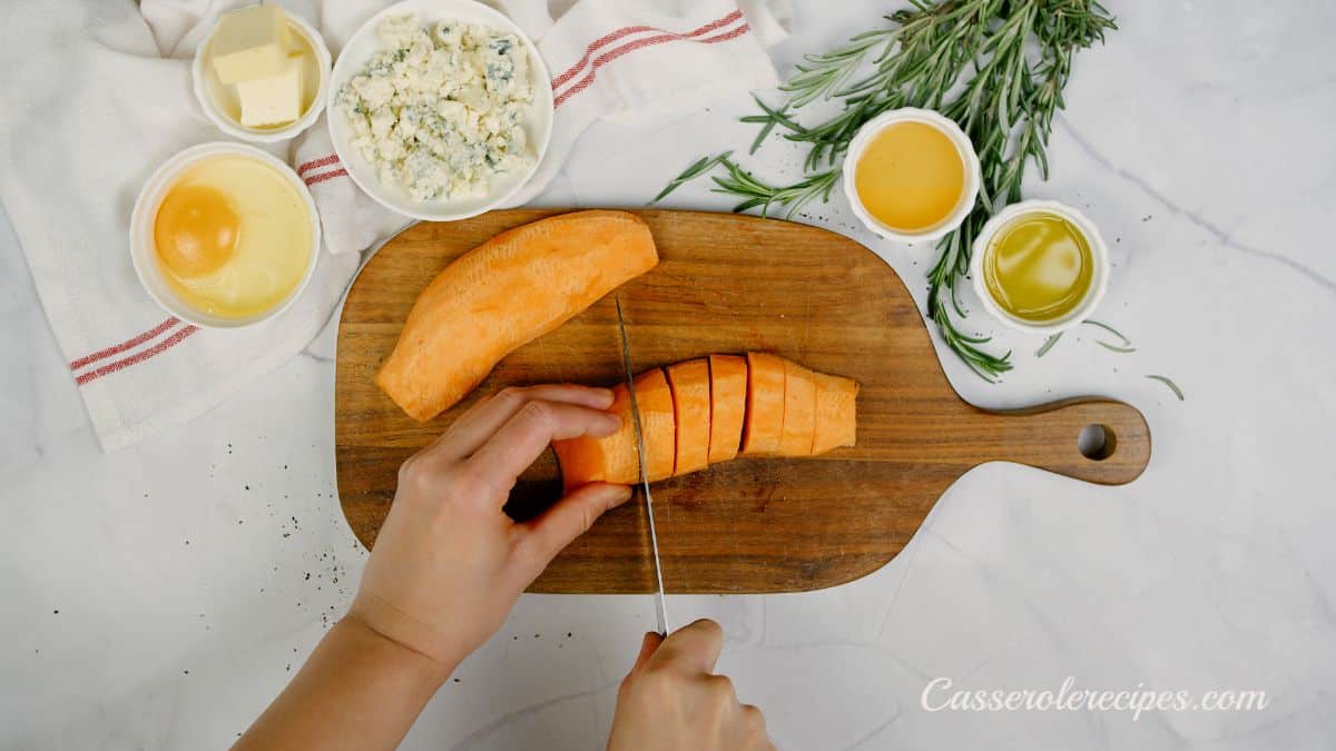 slicing sweet potatoes on cutting board