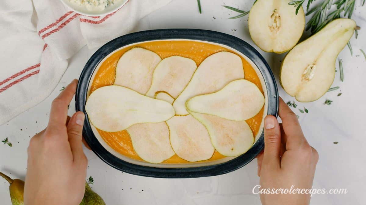 sliced pears on top of baked sweet potato casserole