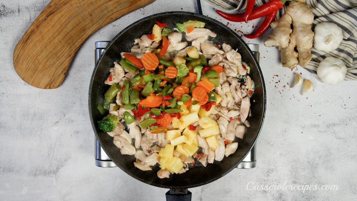 mixed vegetables in skillet with ginger and chicken