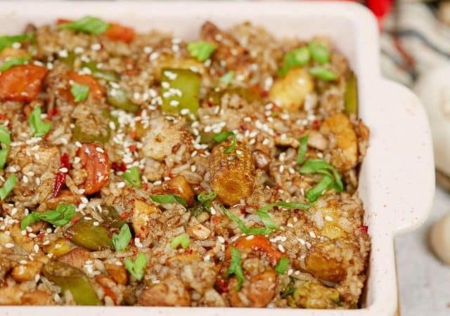 chicken and rice with vegetables in baking dish