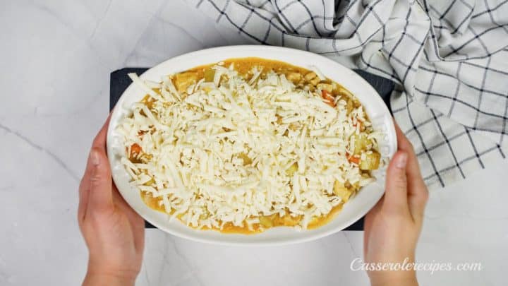 shredded mozzarella on top of casserole dish