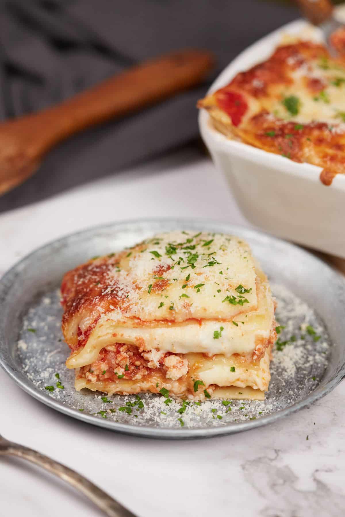 slice of lasagna on gary plate