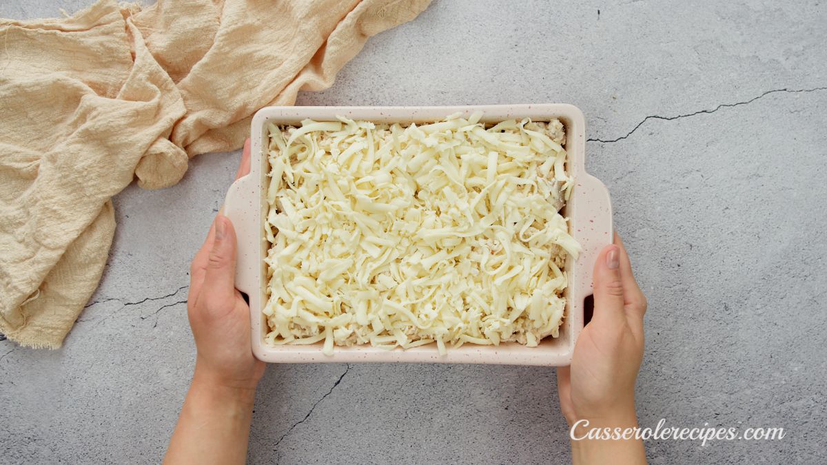 baking dish of unbaked casserole being held