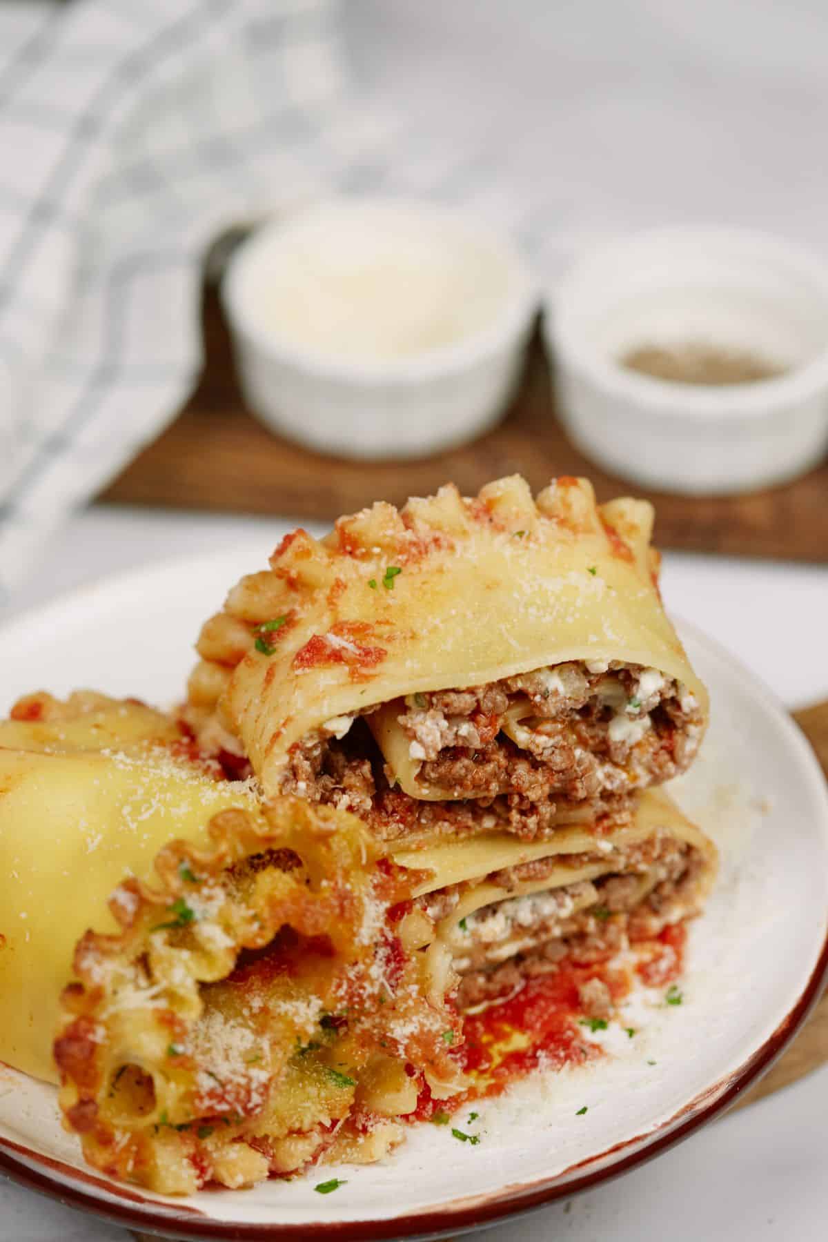 stack of lasagna rolls on white plate