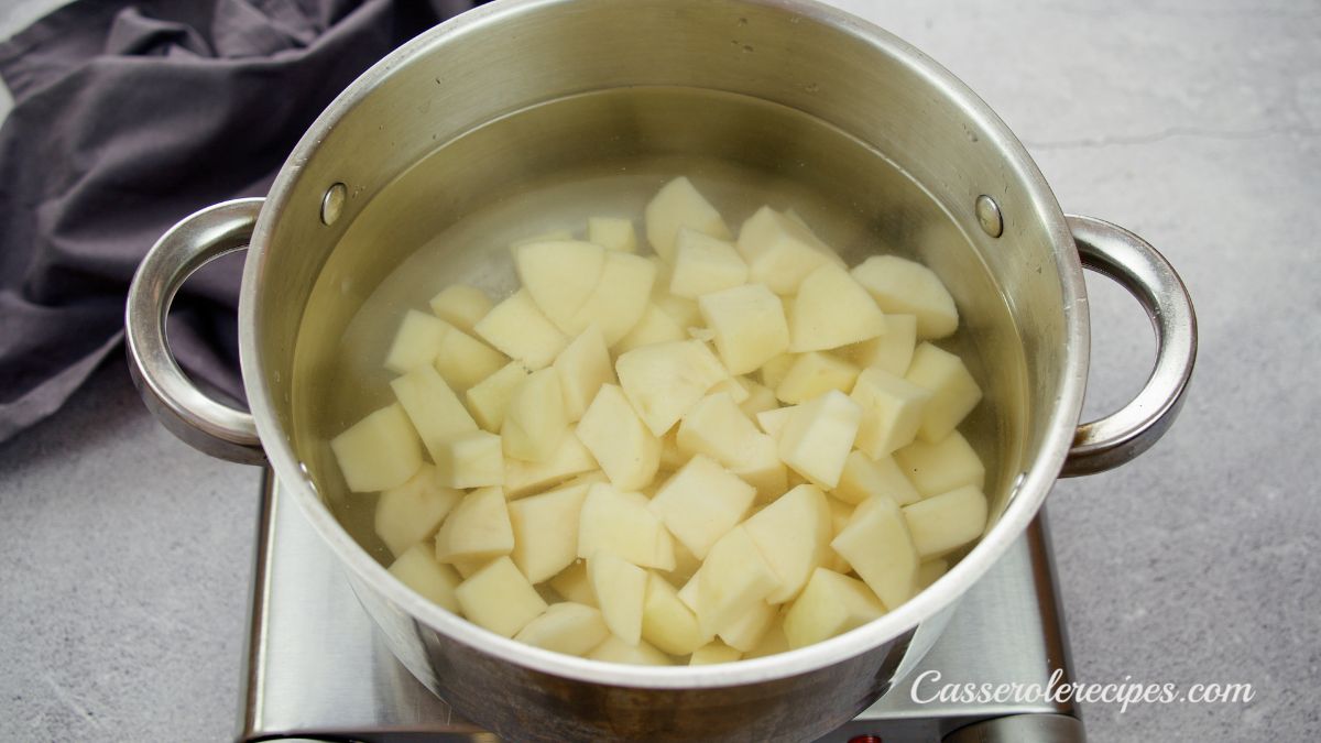 potatoes in stockpot of water on hot plate
