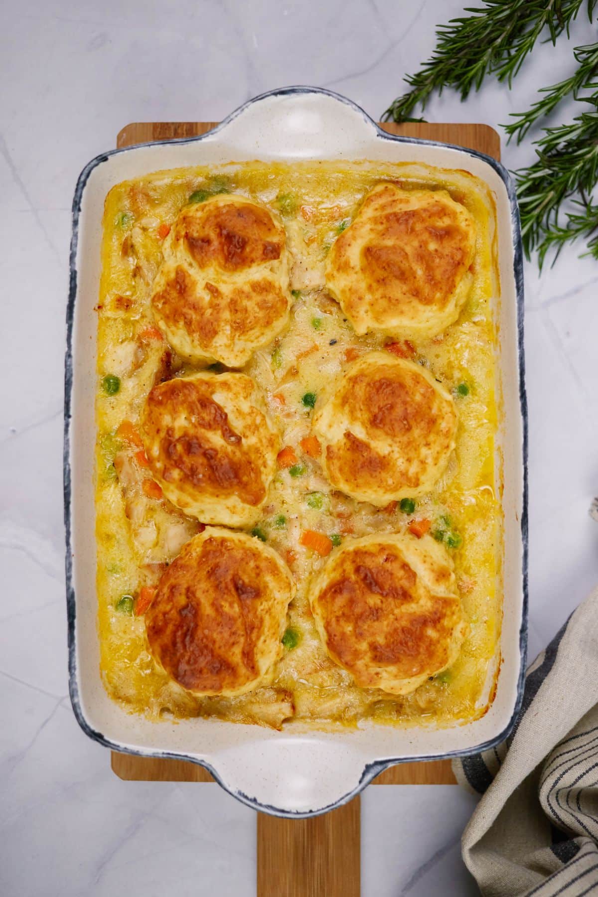 rectangle baking dish of chicken and dumpling casserole on marble counter