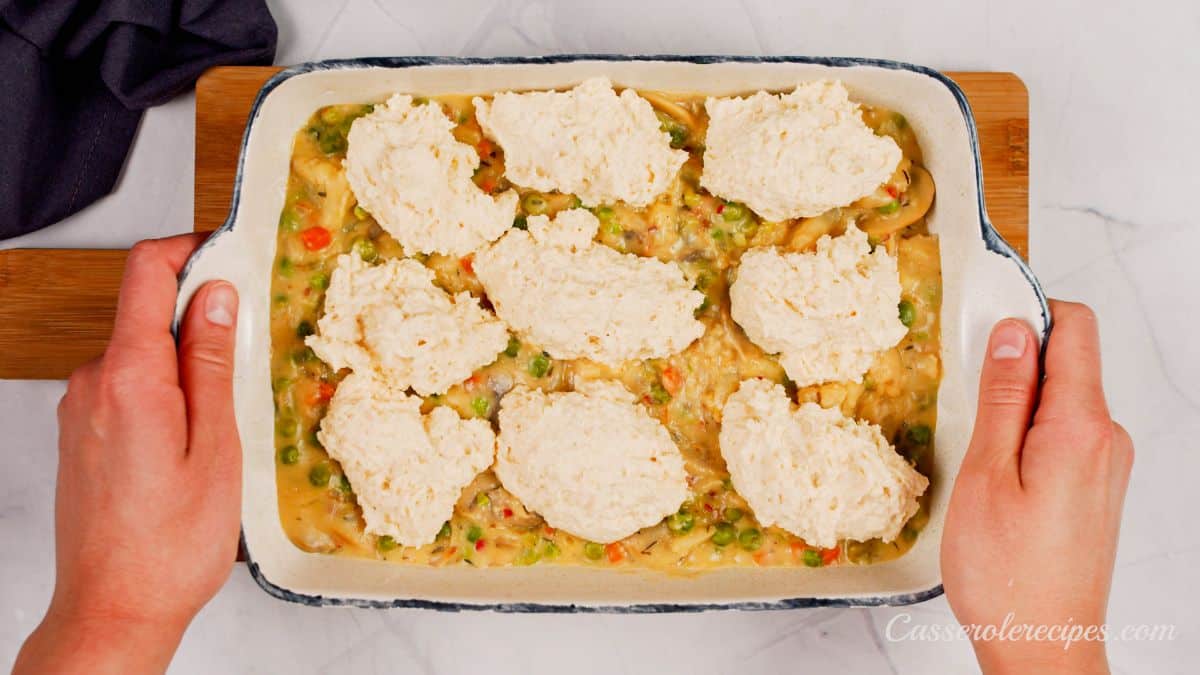 unbaked pot pie with biscuits on top