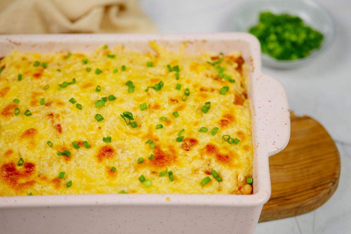 baking dish filled with casserole topped with herbs