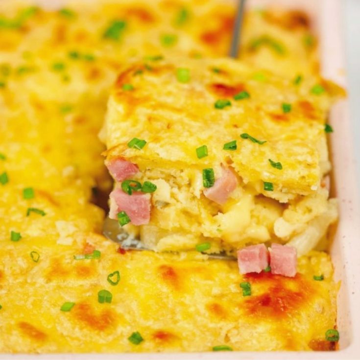 spatula in side of ham pineapple and cheese casserole