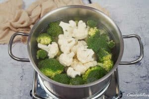 cauliflower and broccoli florets being blanched to make Crustless Quiche with Broccoli and Cauliflower