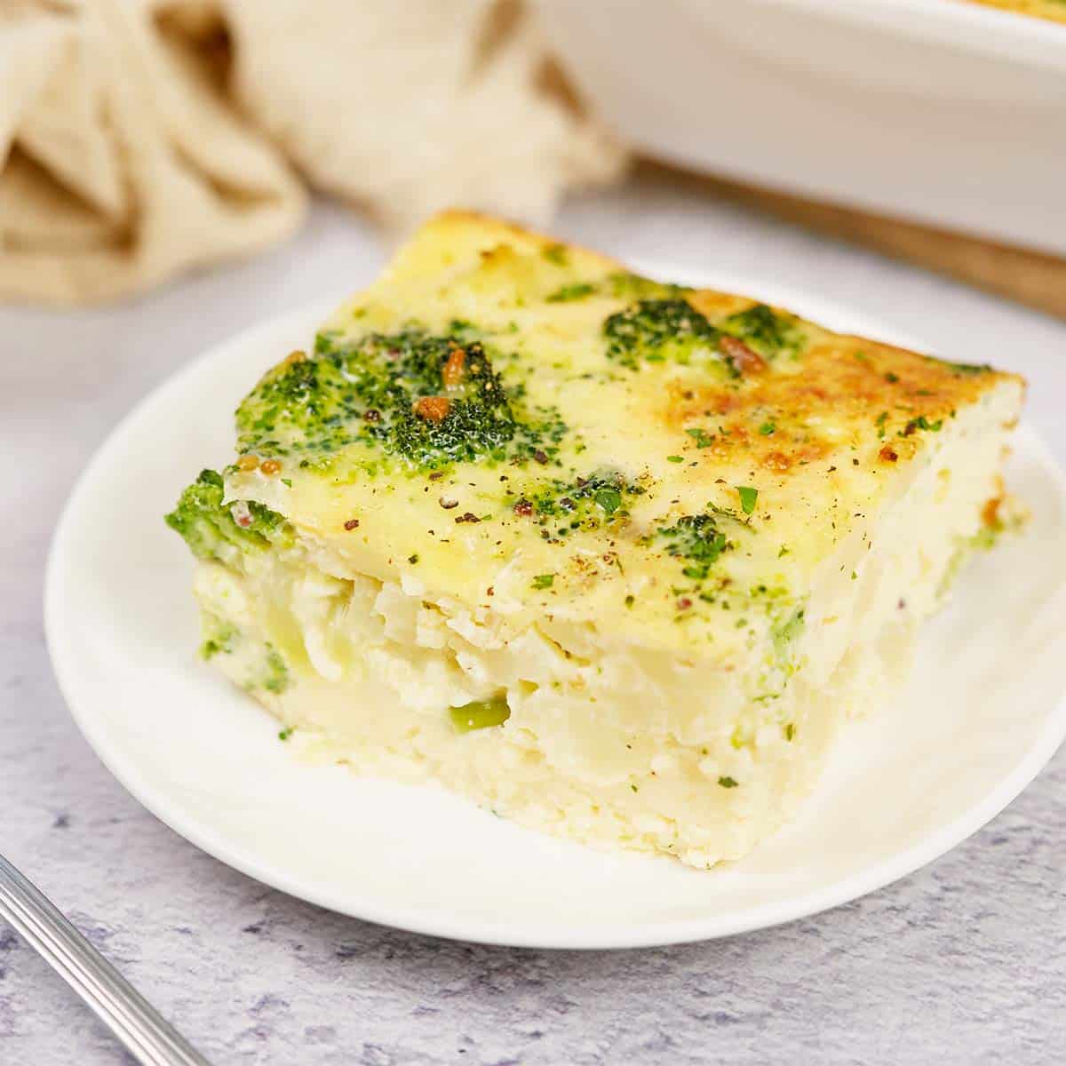plate with a serving of Crustless Quiche with Broccoli and Cauliflower ready to enjoy