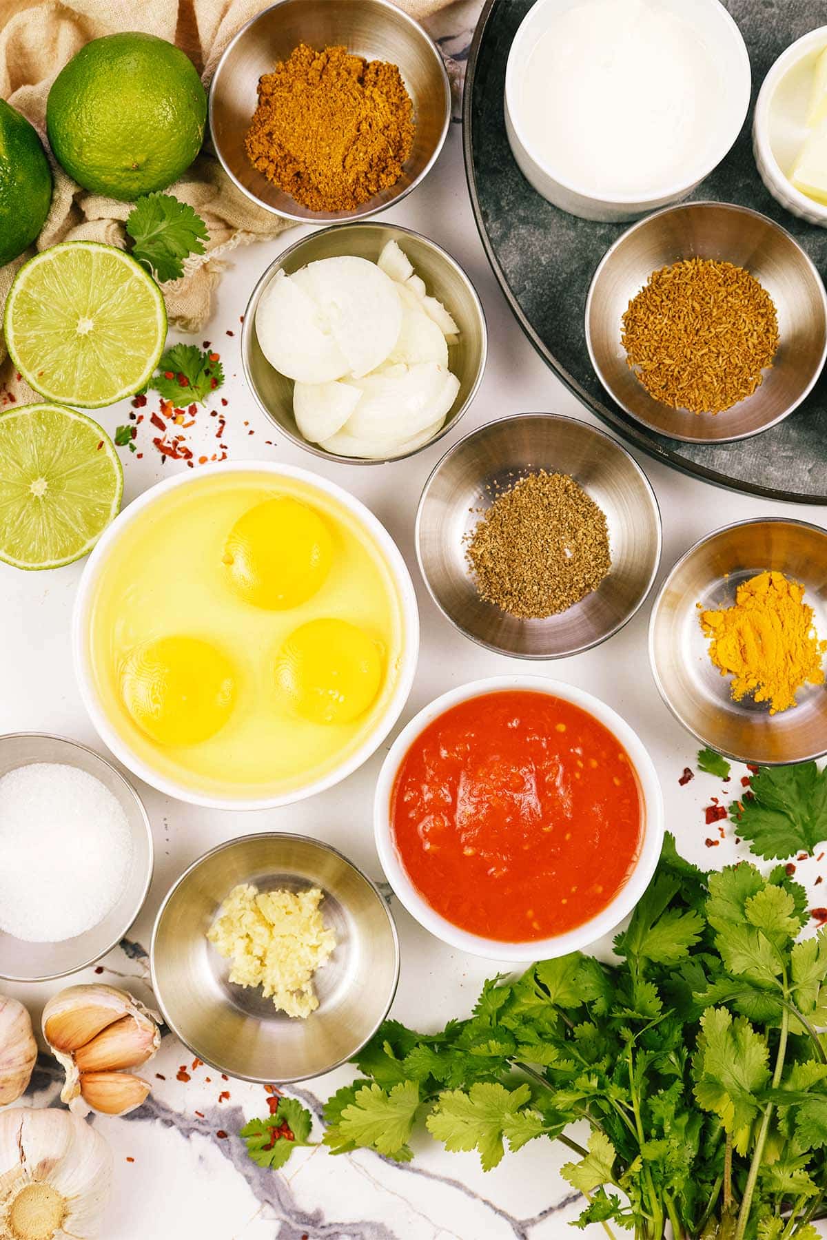 ingredients laid out on a table to make North Indian Baked Eggs