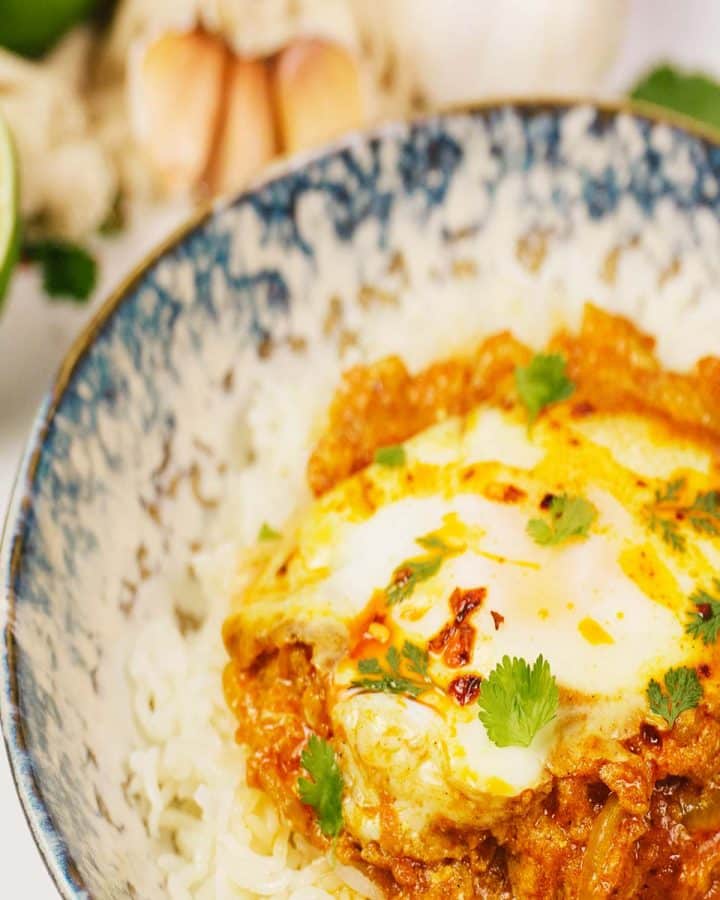 closeup of a bowl filled with a serving of North Indian Baked Eggs