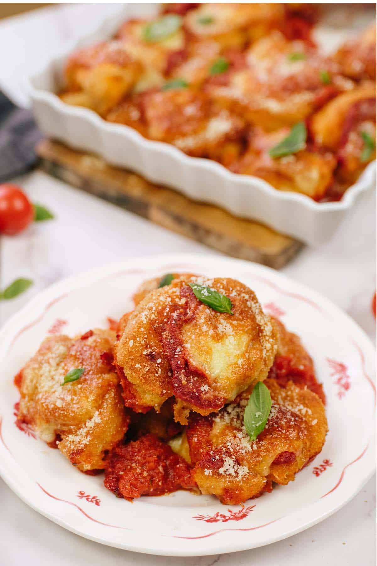 serving of cauliflower parmesan casserole on a white plate