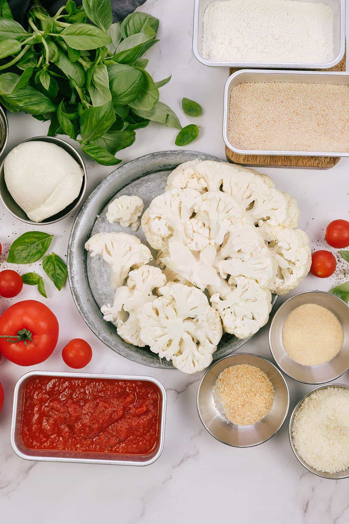 ingredients to make a casserole dinner of cauliflower parmesan