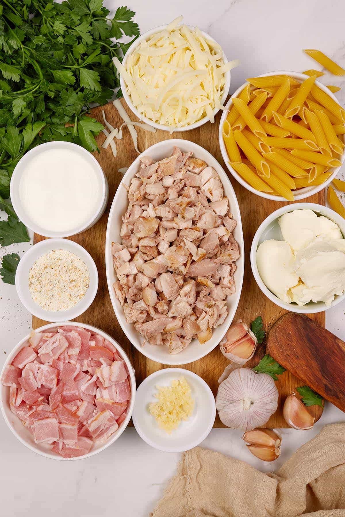 ingredients laid out on a table to make chicken and bacon casserole