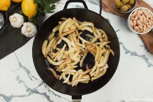 caramelizing fennel and garlic to make Chicken and Bean Summer Casserole