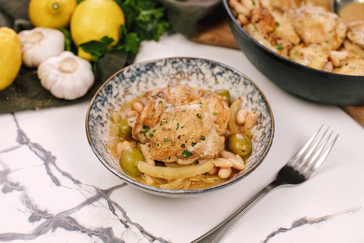 bowl of Chicken and Bean Summer Casserole with olives and fennel