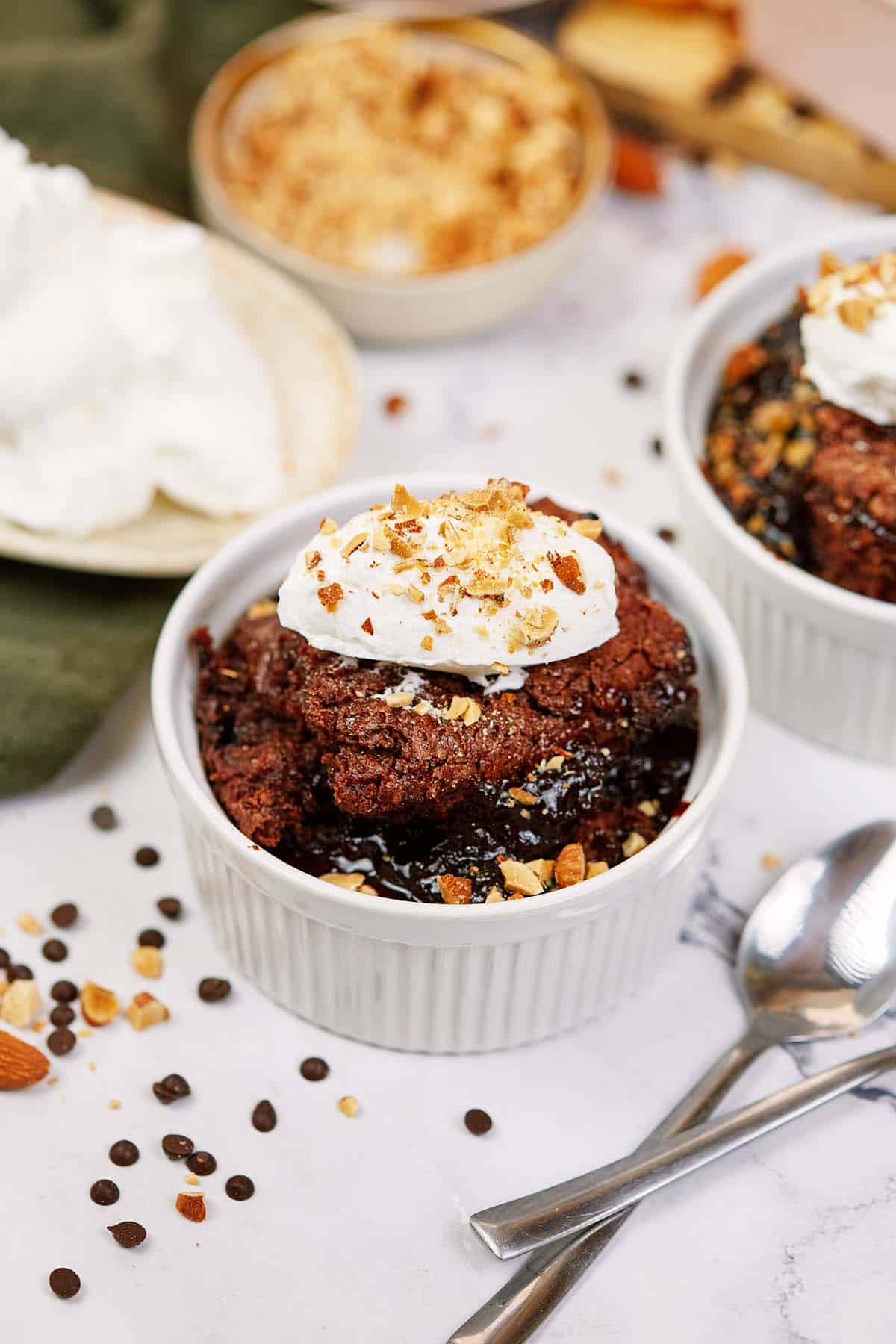 single serving of chocolate cobbler in a bowl topped with ice cream