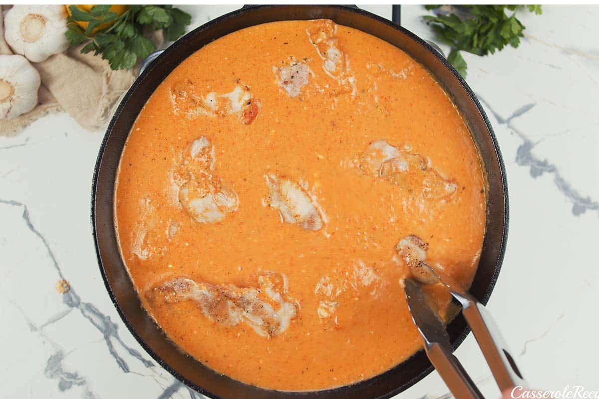 cooking creamy chicken casserole in a frying pan