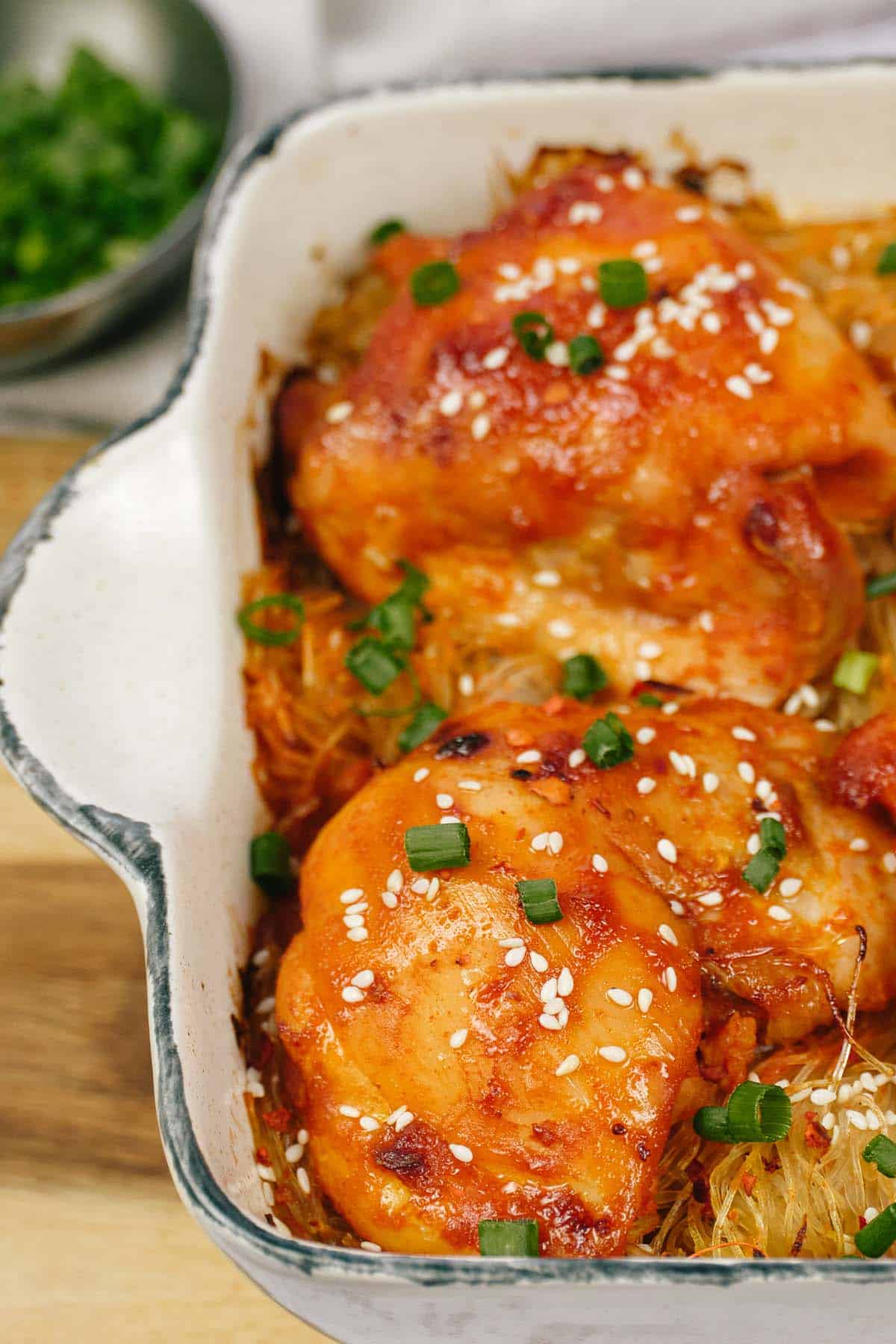 closeup of korean spicy chicken rice noodle bake in a casserole dish