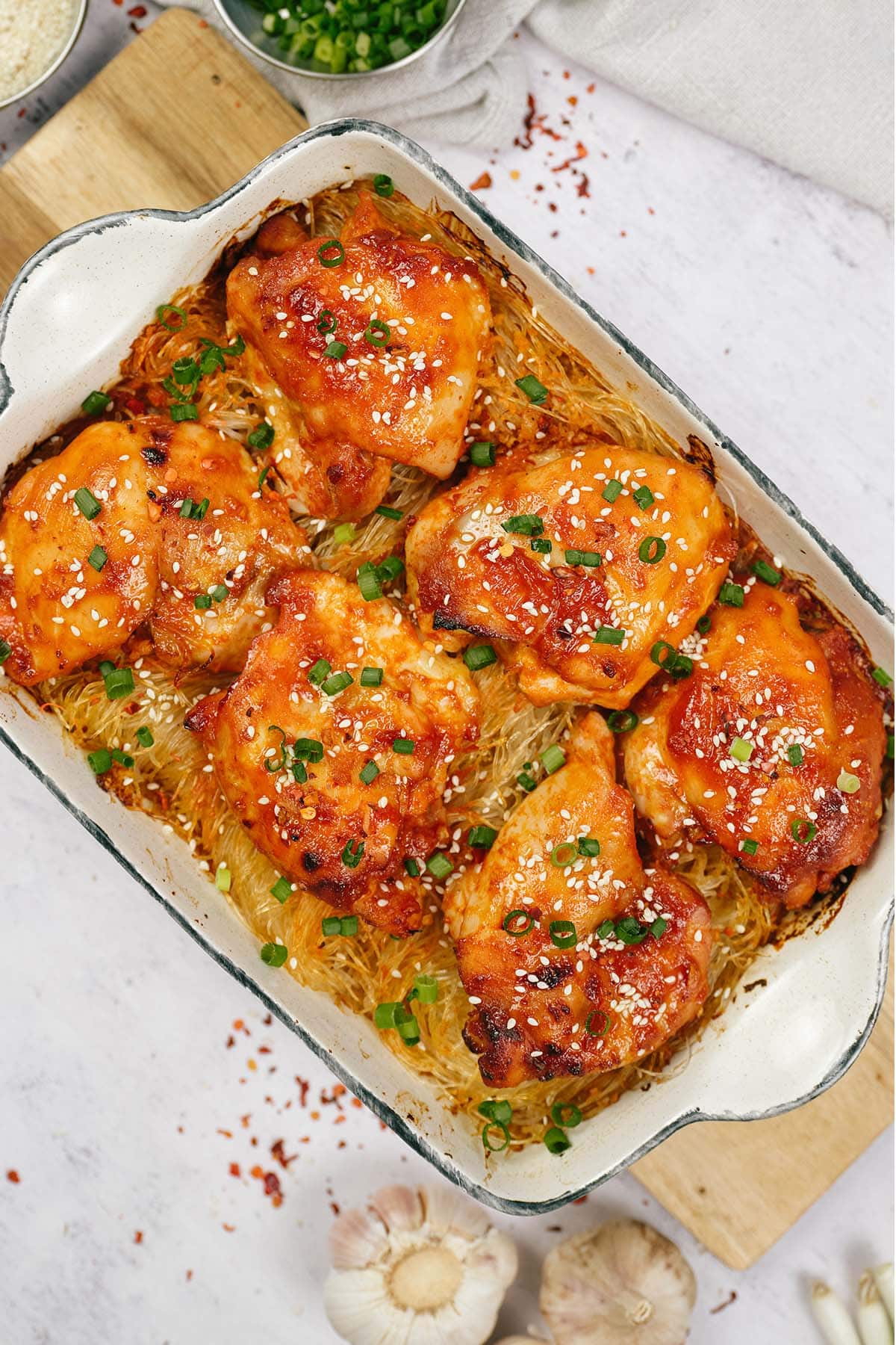 overhead view of a casserole dish filled with korean spicy chicken rice noodle bake