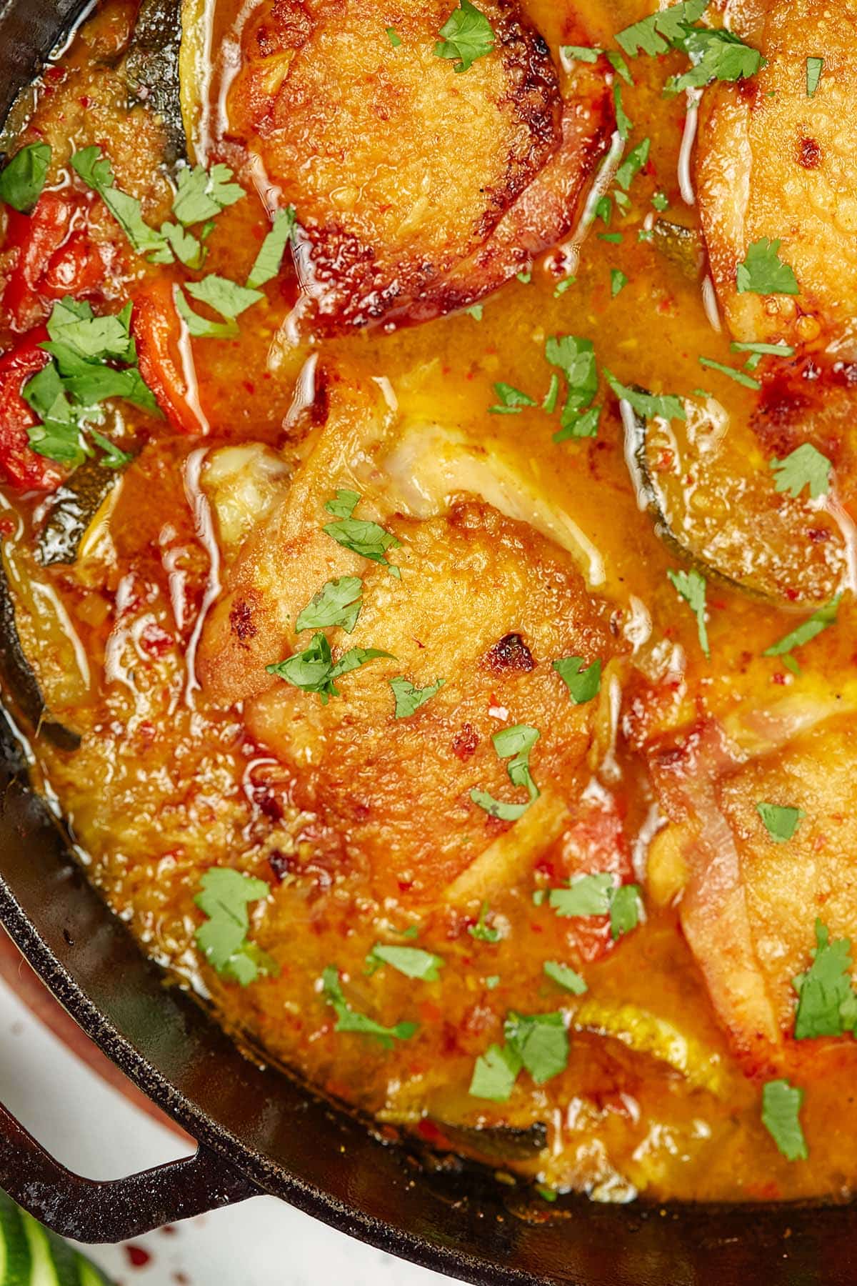 closeup of moroccan chicken casserole in a cast iron skillet