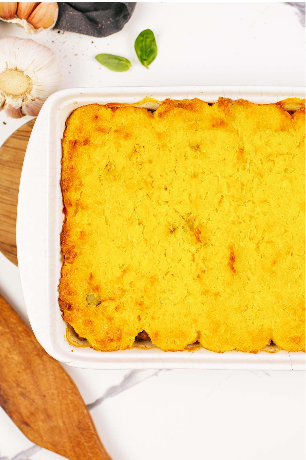 closeup of pastel de chocolo corn and beef casserole in a baking dish