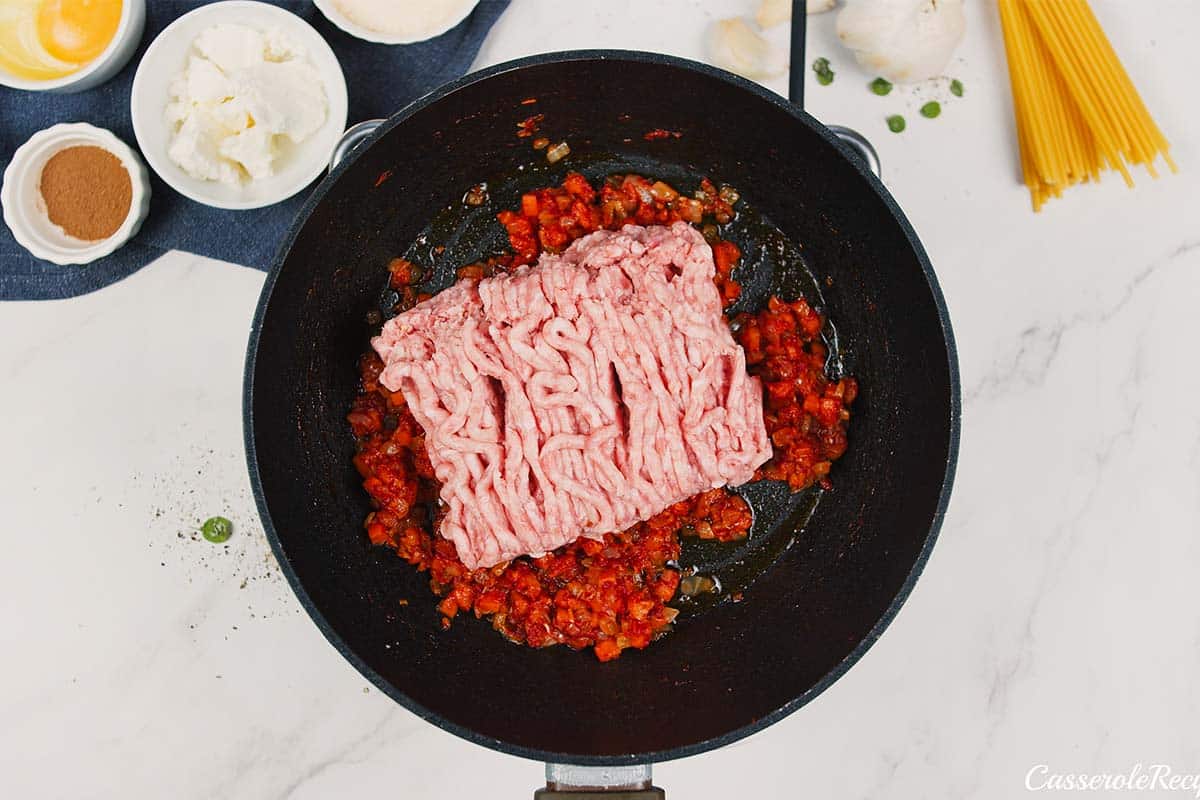 meat being cooked to make pastitsio greek beef pasta bake