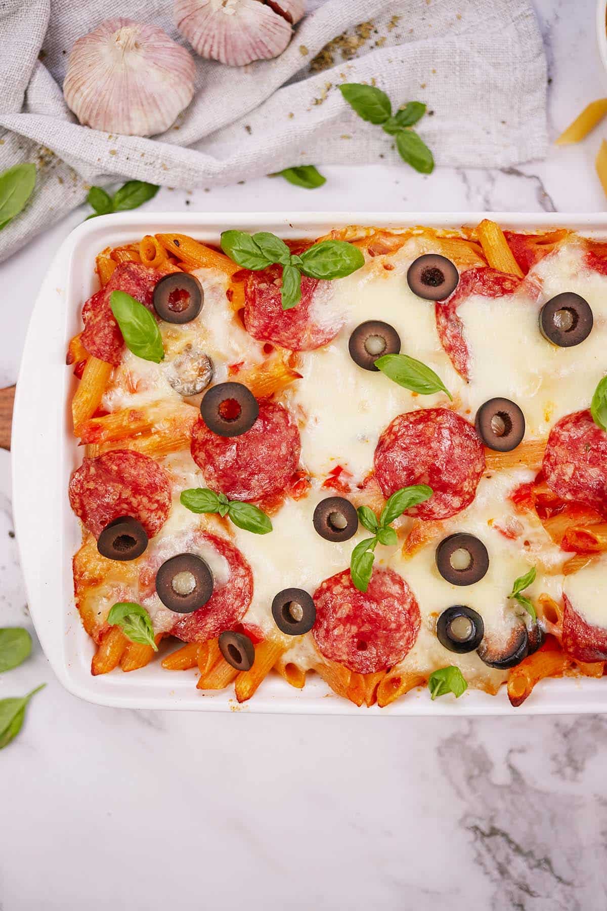 pepperoni pasta bake in a baking dish ready to serve