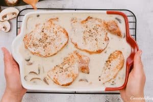 final step of making pork chops and rice casserole prior to baking