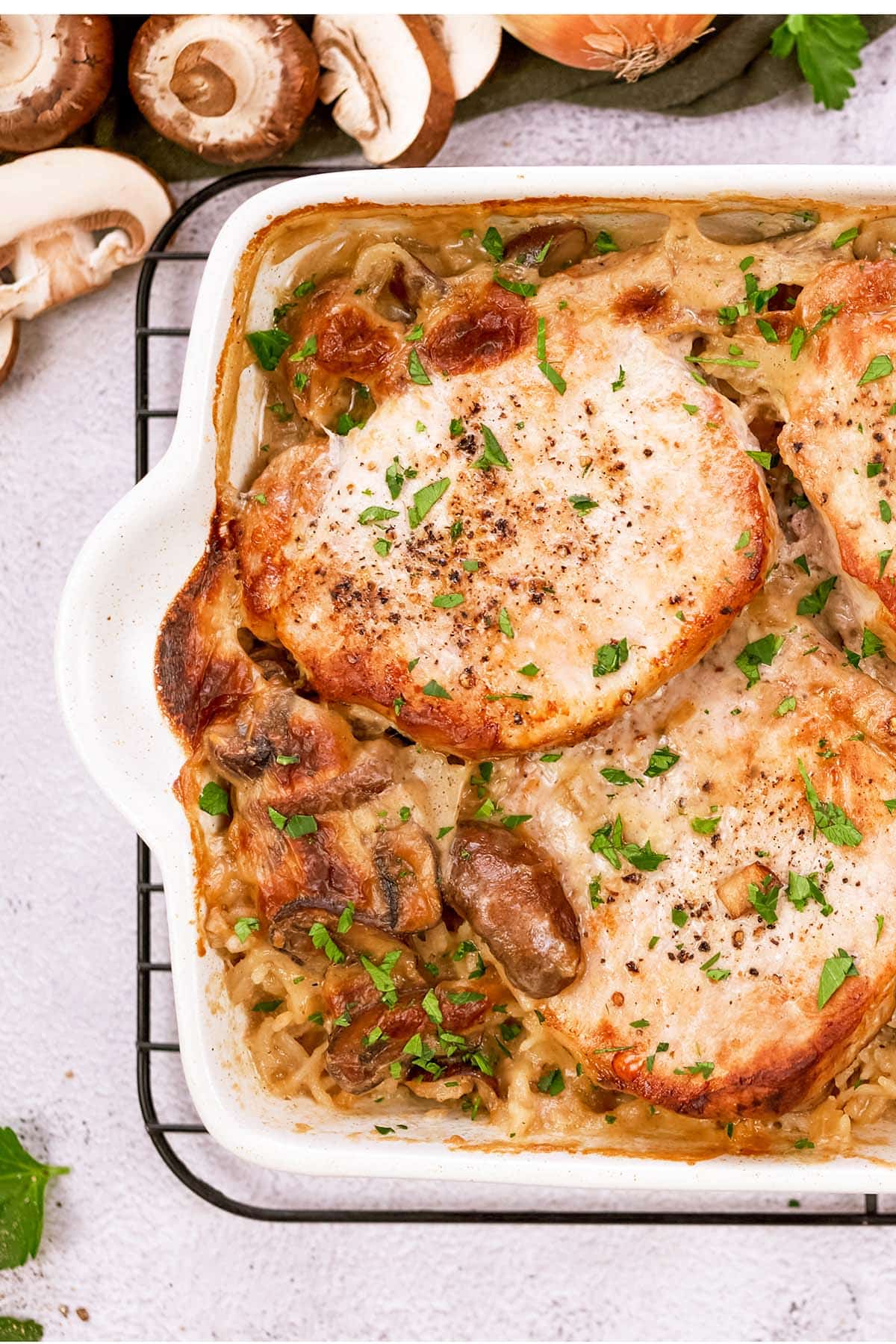 baking dish of pork chops and rice casserole ready to serve