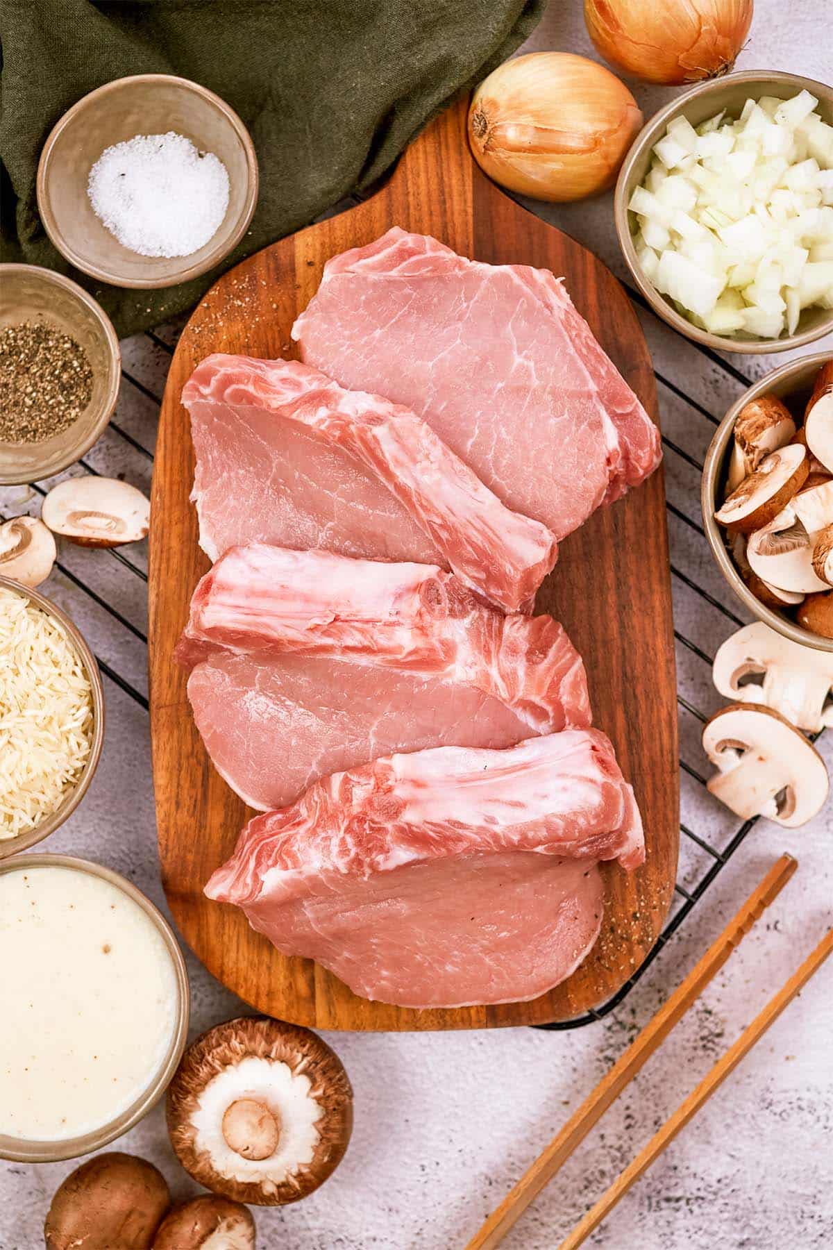 ingredients laid out on a table to make pork chops and rice casserole