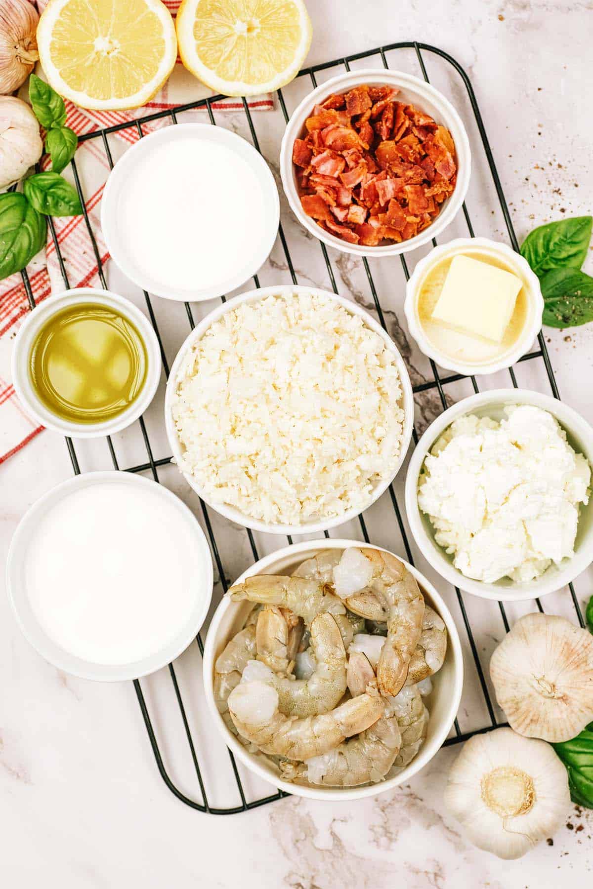 overhead view of ingredients to make shrimp and cauliflower bake on a table