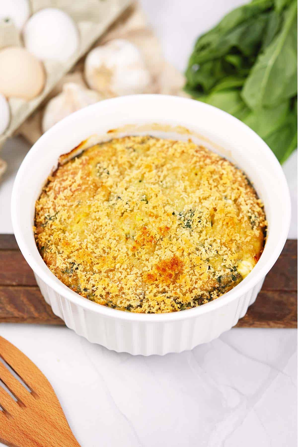 baking dish of spinach casserole with feta fresh from the oven ready to serve