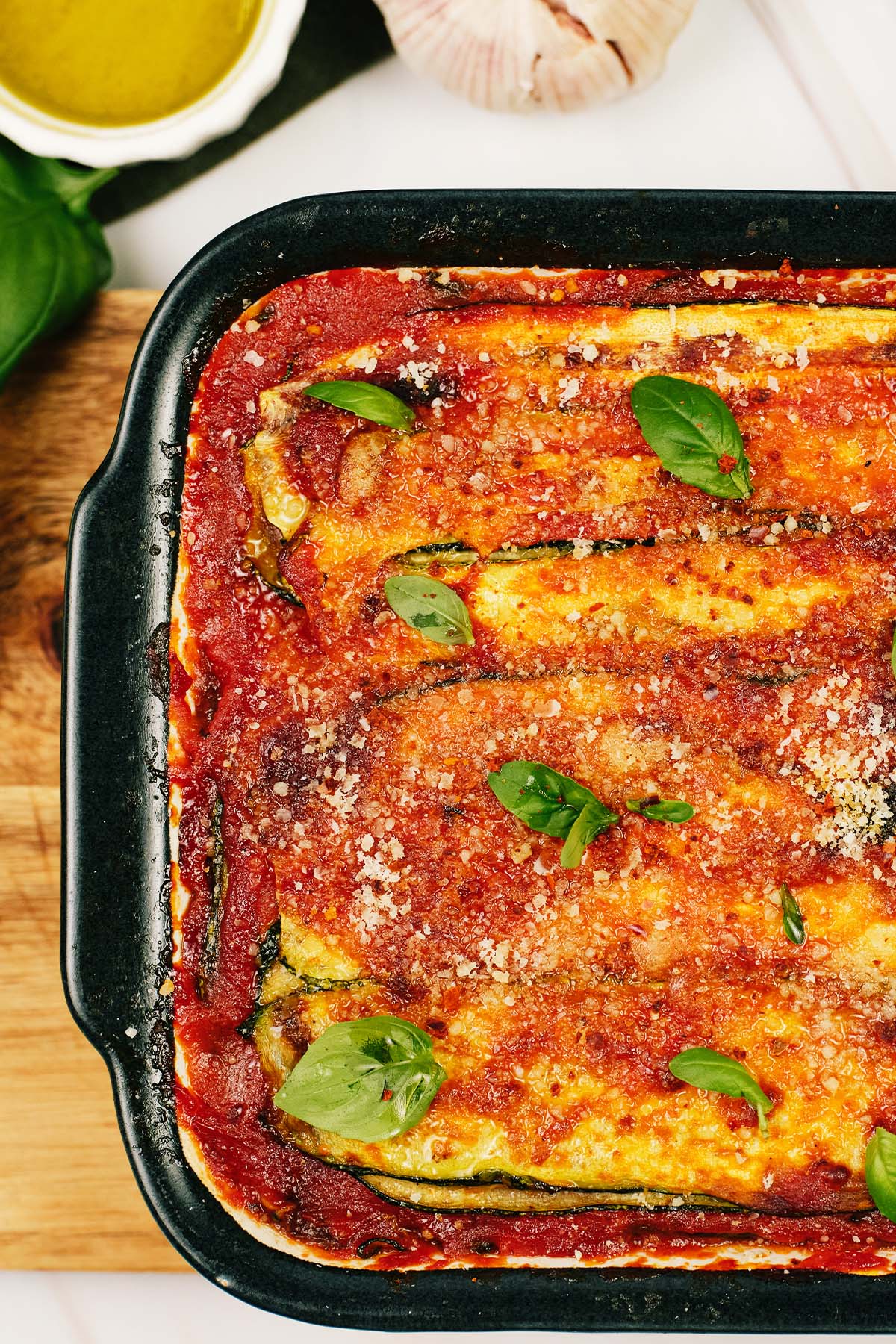 closeup of Zucchini Parmesan in a baking dish ready to serve