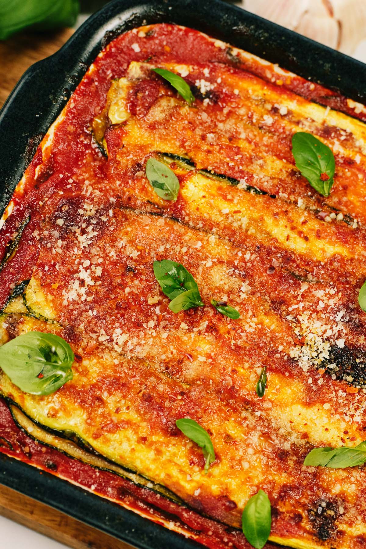 closeup of a casserole dish of homemade Zucchini Parmesan