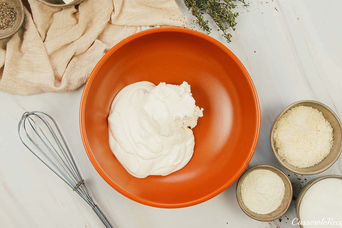 combining ingredients to make the sauce for Cacio e Pepe Casserole