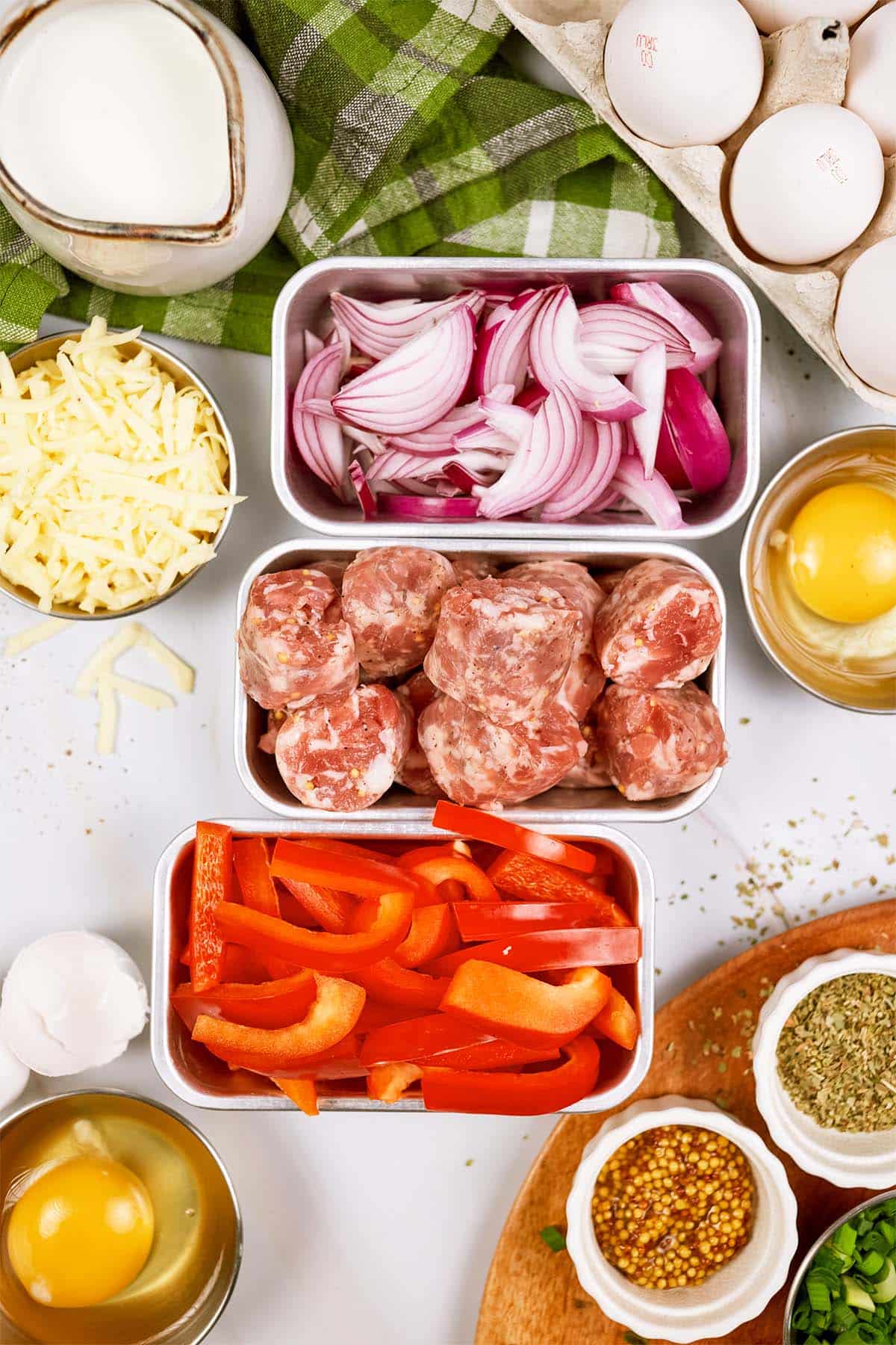 ingredients laid out on a table to make Cheesy Sausage Breakfast Casserole