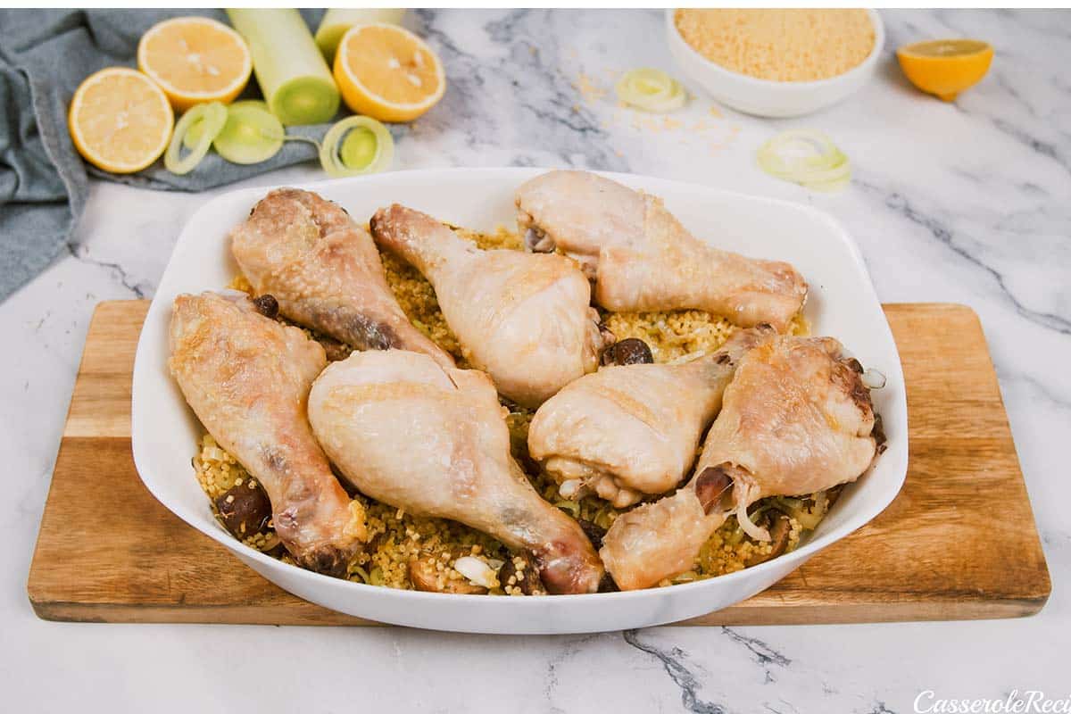 layering chicken and mushrooms in a baking dish to make Chicken and Rosini Bake