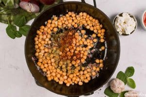 sauteing chickpeas to make Mediterranean Chickpea Casserole