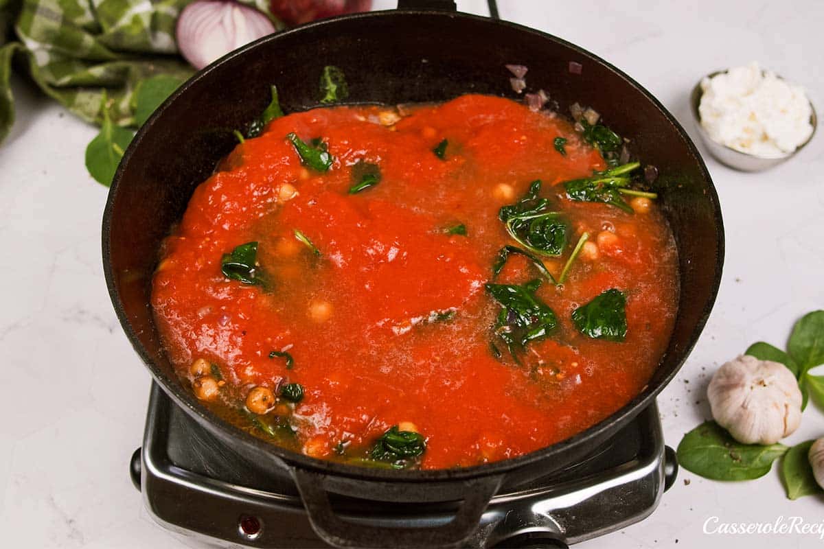 final step in making Mediterranean Chickpea Casserole before baking