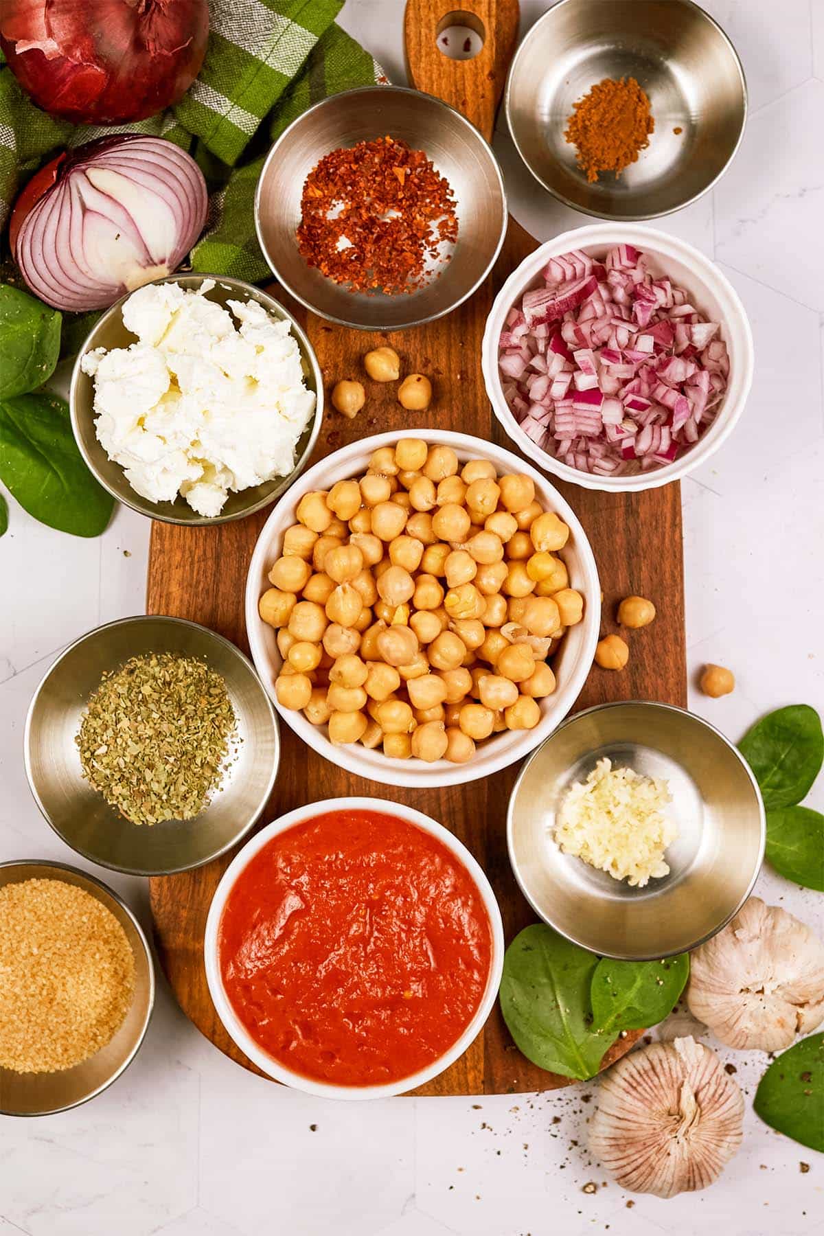 overhead view of ingredients to make Mediterranean Chickpea Casserole laid out on a table